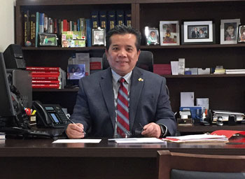 Tony Du sitting at a desk